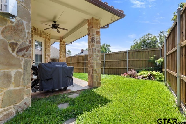 view of yard featuring ceiling fan