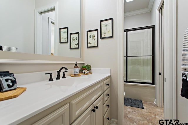 bathroom featuring vanity, tile patterned floors, and ornamental molding