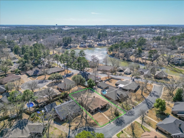 birds eye view of property with a water view and a residential view