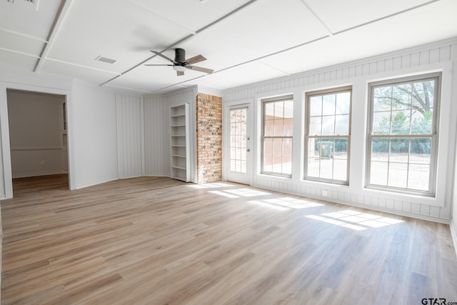 interior space with light wood-type flooring, visible vents, and a ceiling fan