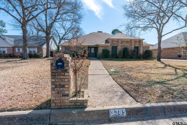 view of front of house with brick siding