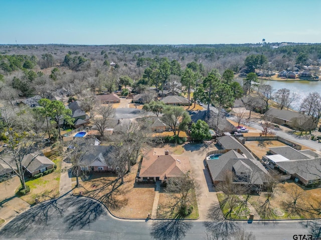 birds eye view of property with a water view and a residential view