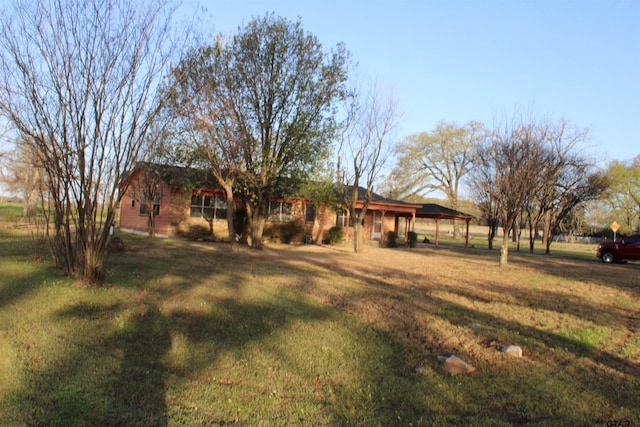 view of yard with a carport