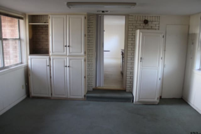 interior space featuring light carpet
