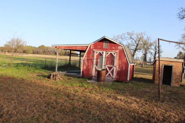 view of shed featuring fence