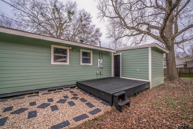 rear view of property featuring a deck