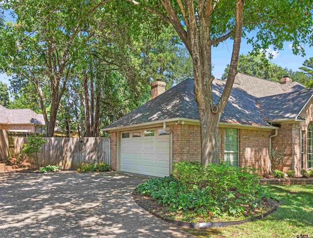 view of side of home featuring a garage