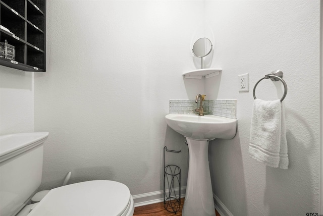 301 W Charnwood St, Tyler, TX 75701 - half bath featuring toilet and wood finished floors