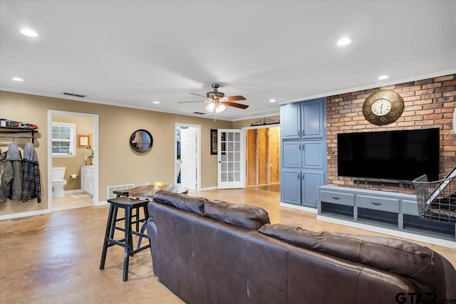 living room featuring crown molding and ceiling fan