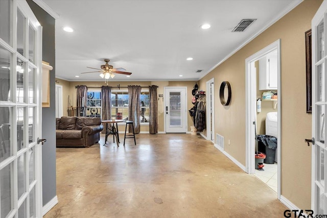 living room with crown molding, french doors, and ceiling fan