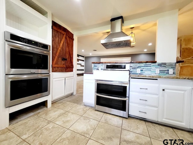 kitchen with stainless steel appliances, light stone counters, white cabinets, tasteful backsplash, and island exhaust hood