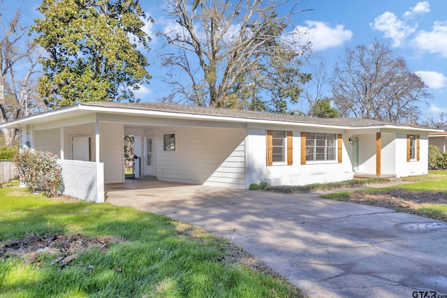 ranch-style home with a carport