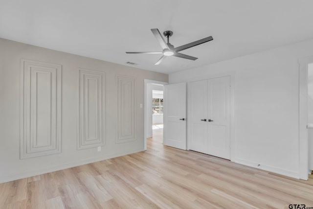 unfurnished bedroom featuring ceiling fan and light hardwood / wood-style floors