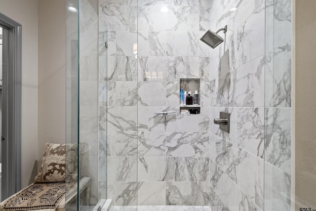 full bathroom with a tile shower