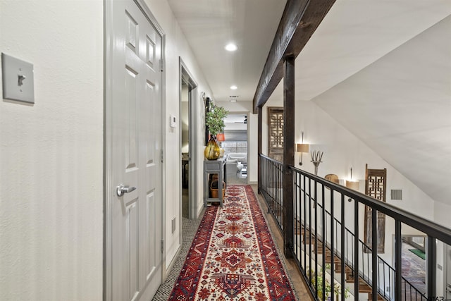 corridor with visible vents, recessed lighting, and lofted ceiling
