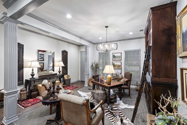 living room with crown molding, ornate columns, and wood finished floors