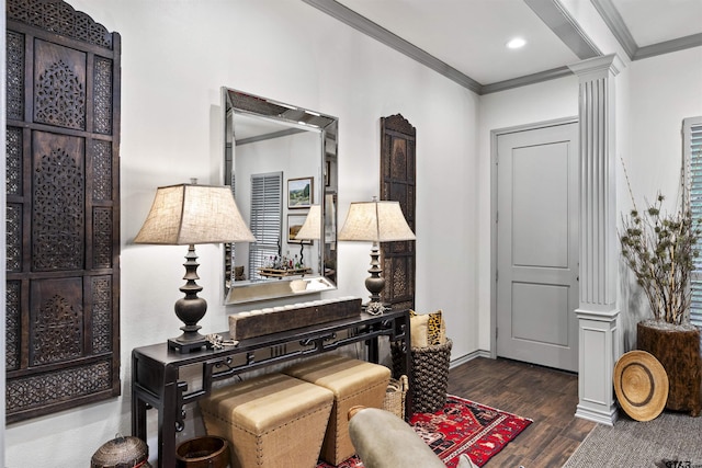 living area with crown molding, decorative columns, wood finished floors, baseboards, and recessed lighting