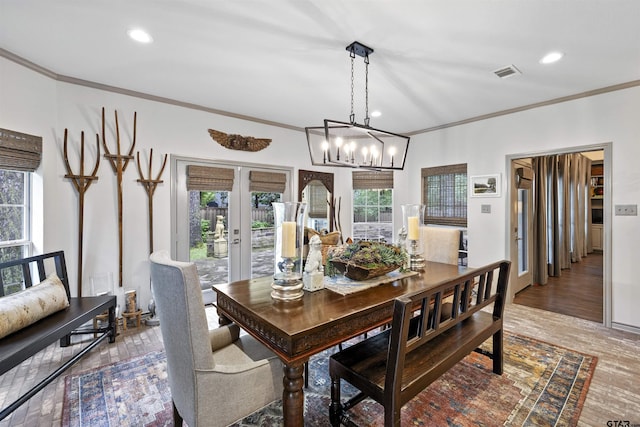dining space featuring visible vents, ornamental molding, recessed lighting, french doors, and a notable chandelier