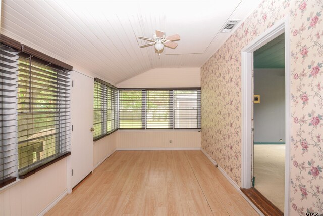 spare room featuring wooden ceiling, ceiling fan, light hardwood / wood-style flooring, and lofted ceiling