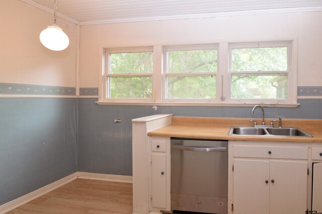 kitchen with white cabinetry, light wood-type flooring, hanging light fixtures, sink, and stainless steel dishwasher