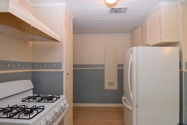 kitchen with white cabinets, white appliances, light hardwood / wood-style flooring, and ornamental molding