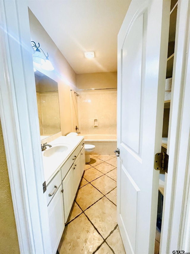 full bathroom with toilet, tub / shower combination, tile patterned flooring, and vanity