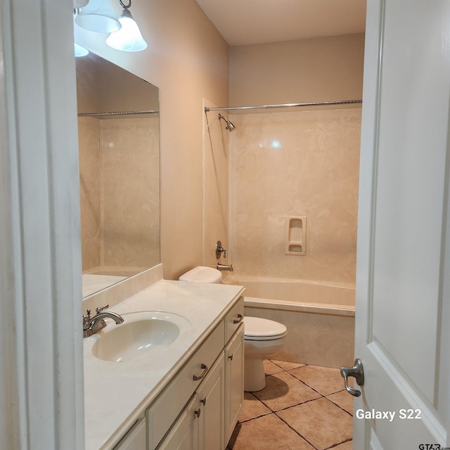 bathroom featuring toilet, vanity, bathtub / shower combination, and tile patterned floors