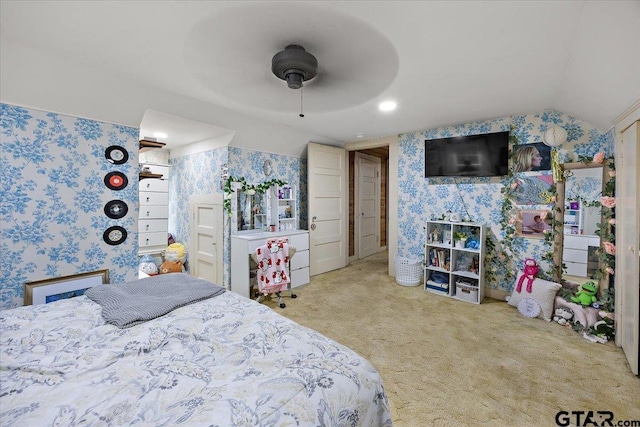 carpeted bedroom featuring wallpapered walls, a ceiling fan, and lofted ceiling