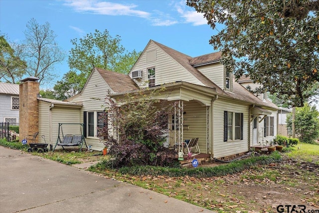 view of front of property with a shingled roof
