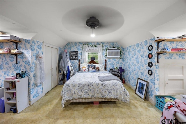 bedroom with wallpapered walls, carpet, and vaulted ceiling