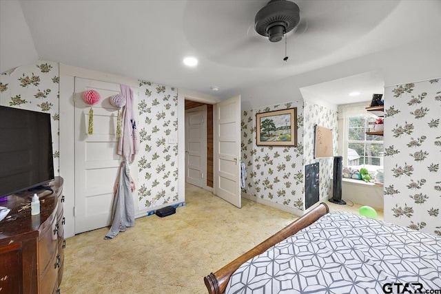 bedroom with wallpapered walls, baseboards, and carpet floors