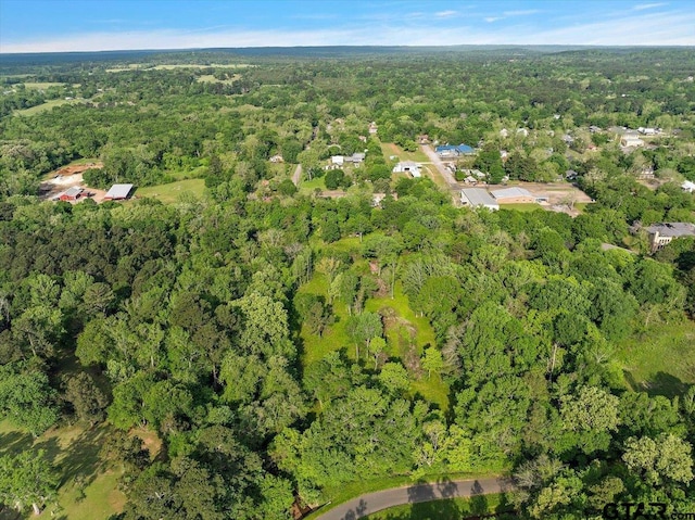 aerial view featuring a view of trees