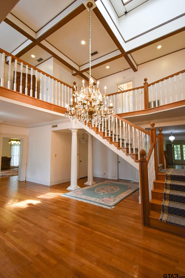 510 E Longview St, Arp, TX 75750 - stairway with a chandelier, wood finished floors, a towering ceiling, recessed lighting, and beamed ceiling
