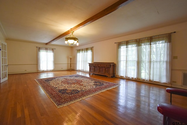 510 E Longview St, Arp, TX 75750 - living area with a chandelier, wood finished floors, beam ceiling, and crown molding