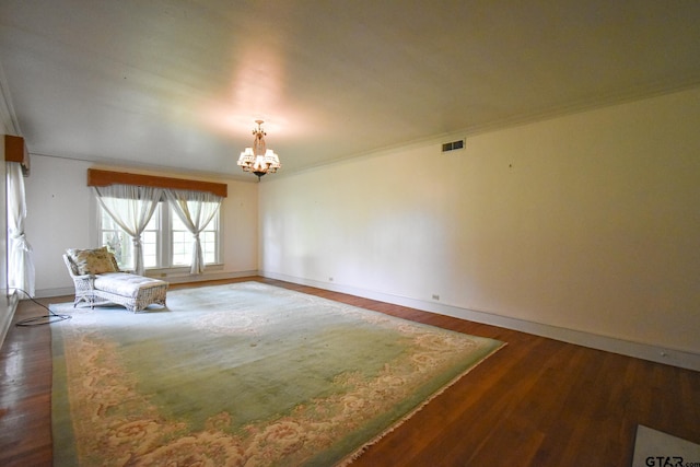 510 E Longview St, Arp, TX 75750 - unfurnished room with a chandelier, wood finished floors, baseboards, and crown molding
