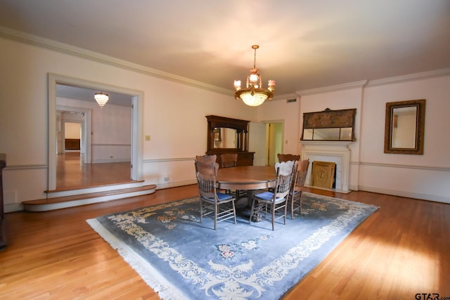 510 E Longview St, Arp, TX 75750 - dining area featuring a chandelier, wood finished floors, and ornamental molding