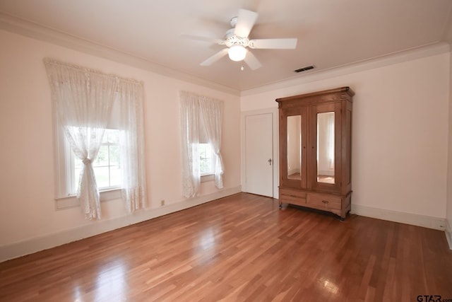 510 E Longview St, Arp, TX 75750 - empty room featuring a ceiling fan, wood finished floors, and baseboards
