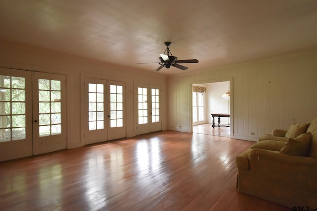 510 E Longview St, Arp, TX 75750 - living area with a ceiling fan, wood finished floors, french doors, crown molding, and a chandelier