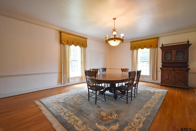 510 E Longview St, Arp, TX 75750 - dining room featuring crown molding, a chandelier, plenty of natural light, and wood finished floors