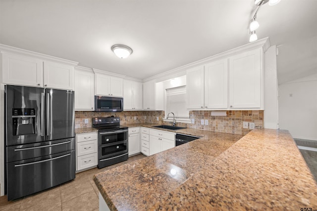 kitchen with tasteful backsplash, kitchen peninsula, sink, appliances with stainless steel finishes, and white cabinets