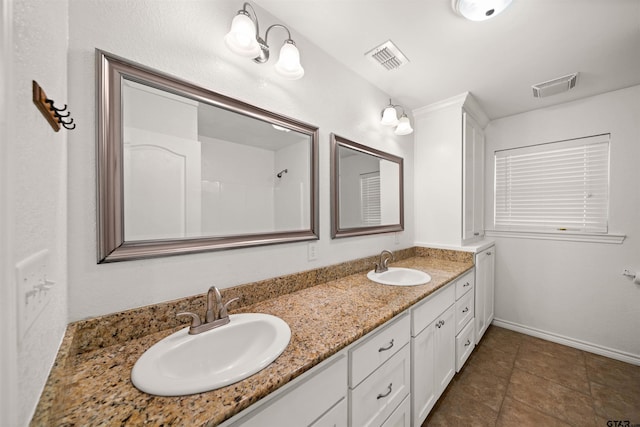 bathroom featuring vanity and tile patterned floors