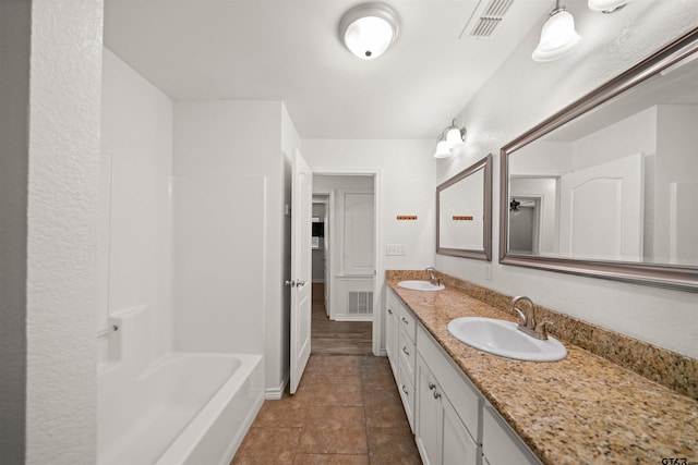 bathroom featuring vanity and tile patterned flooring