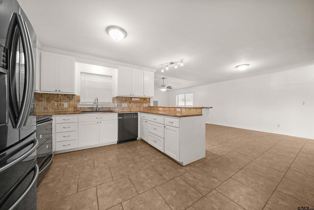 kitchen featuring black appliances, kitchen peninsula, decorative backsplash, sink, and white cabinetry