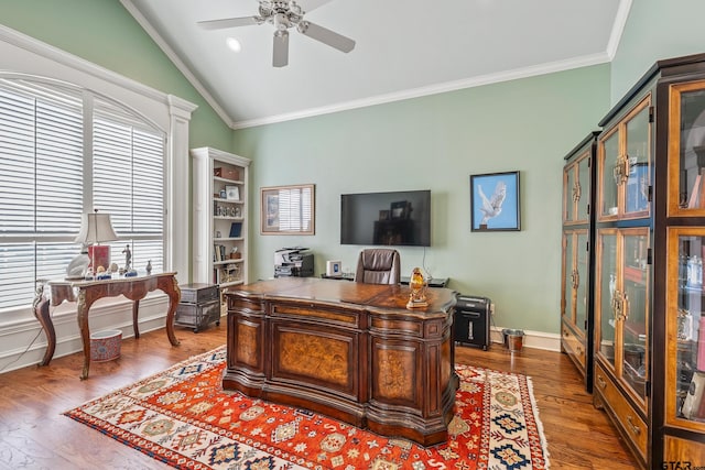 office area with a ceiling fan, lofted ceiling, wood finished floors, and ornamental molding