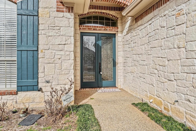 view of exterior entry with stone siding