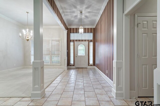 6529 Salisbury Ln, Tyler, TX 75703 - foyer entrance featuring a chandelier, ornamental molding, and baseboards
