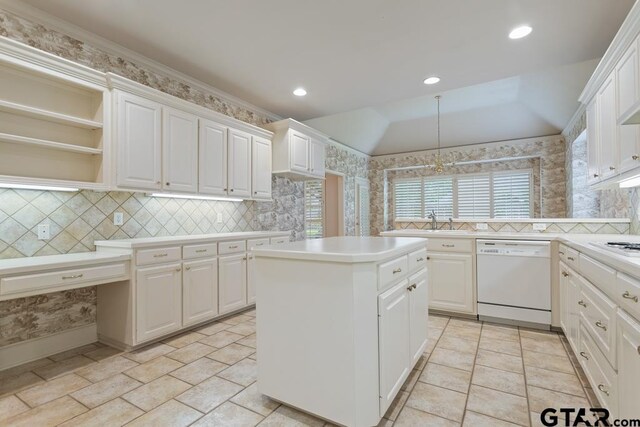 6529 Salisbury Ln, Tyler, TX 75703 - kitchen featuring a sink, white appliances, a center island, white cabinetry, and light countertops