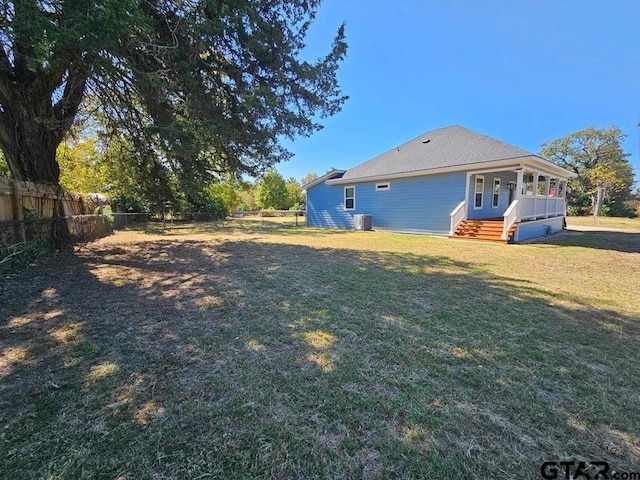 view of yard with central AC