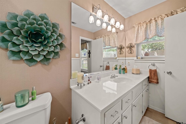812 Jeffery Dr, Tyler, TX 75703 - bathroom with toilet, vanity, and tile patterned flooring