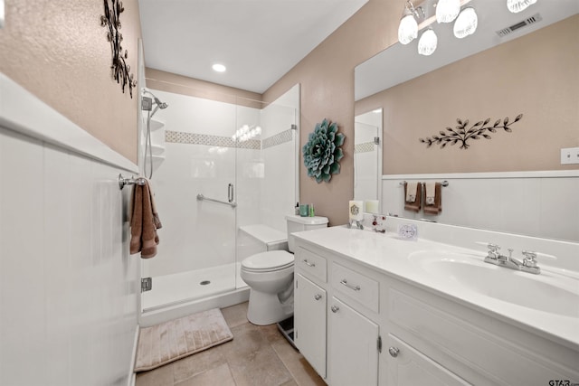 812 Jeffery Dr, Tyler, TX 75703 - bathroom featuring a shower stall, toilet, vanity, and tile patterned flooring